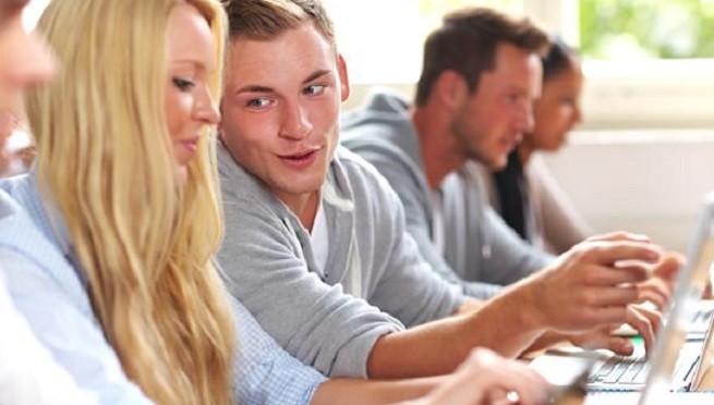 Guy talking to a girl in class