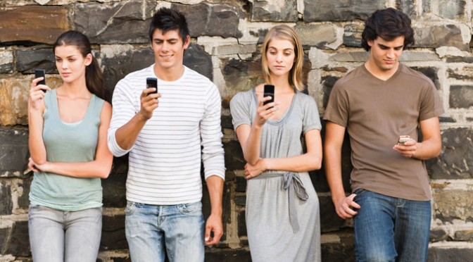 Young group using Tinder app on their smartphones