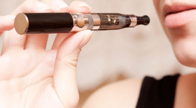 Woman Smoking Vaporizer eCig