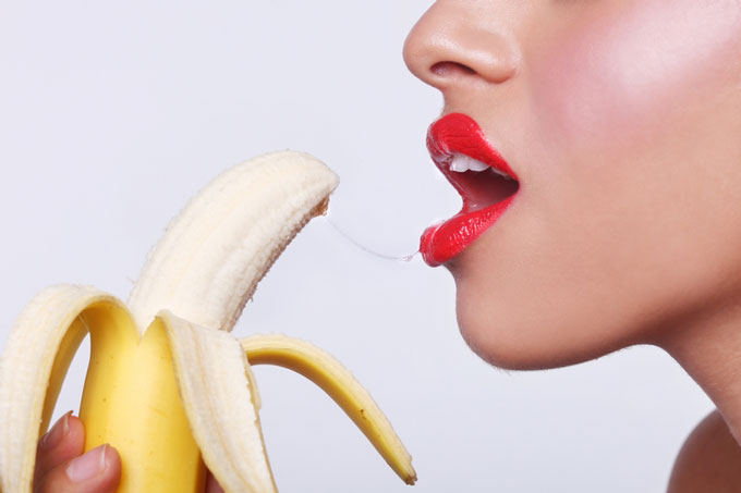 Blowjob Concept: Sensual Woman About to Eat Banana