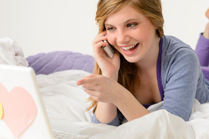 Woman Phone Dating on Her Bed